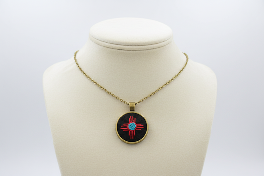 Zia Symbol Embroidered Bronze Pendant (Red & Turquoise)